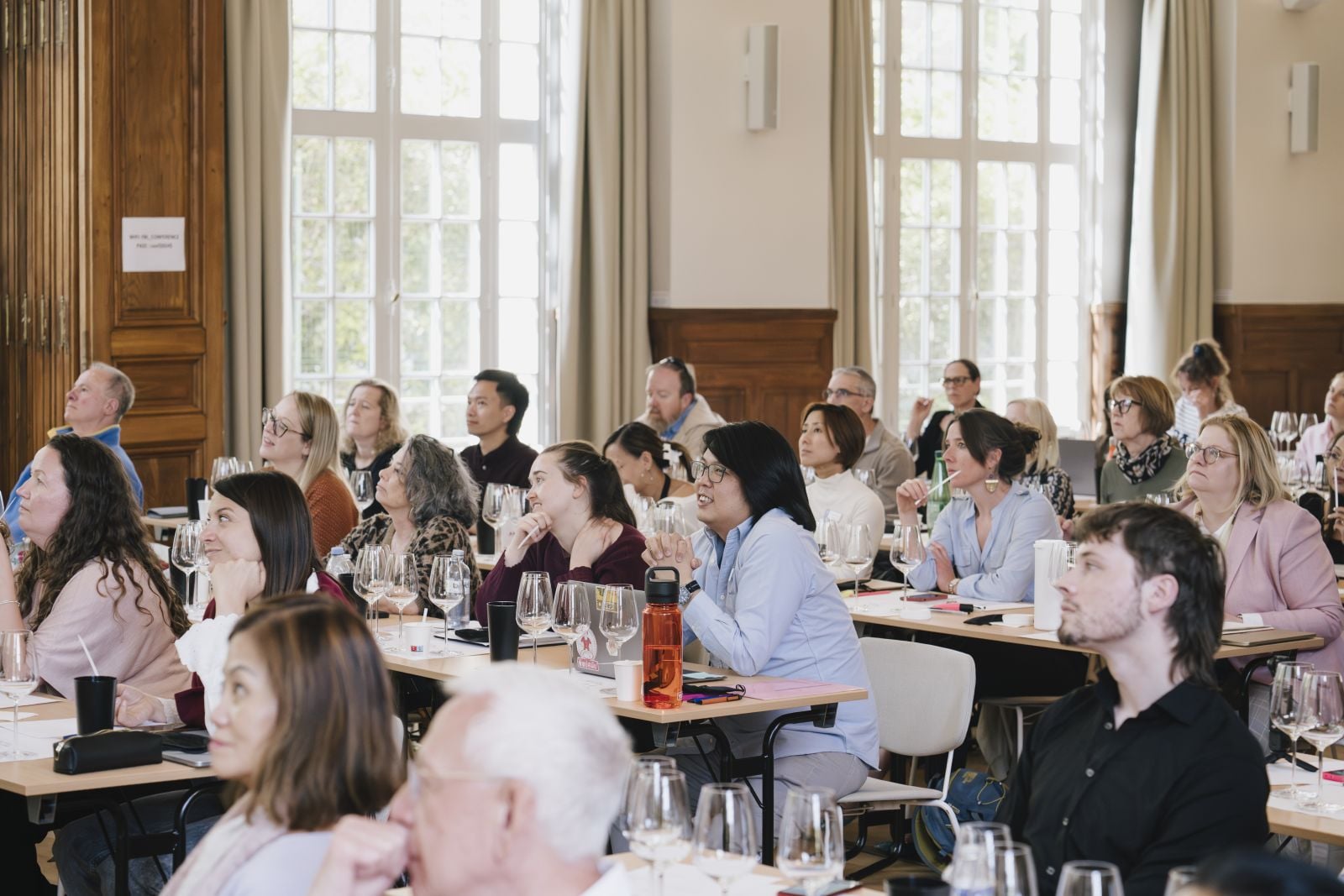 Wine tasting between professional students analyzing white wine.